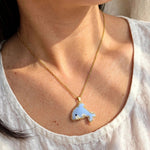 Dolphin necklace on model