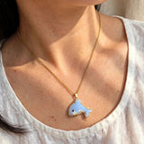 Dolphin necklace on model