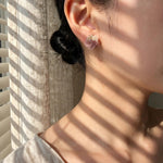 Dreamtide Stud Earrings in Brown on Model