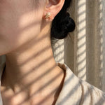 Dreamtide Stud Earrings in Coral on Model