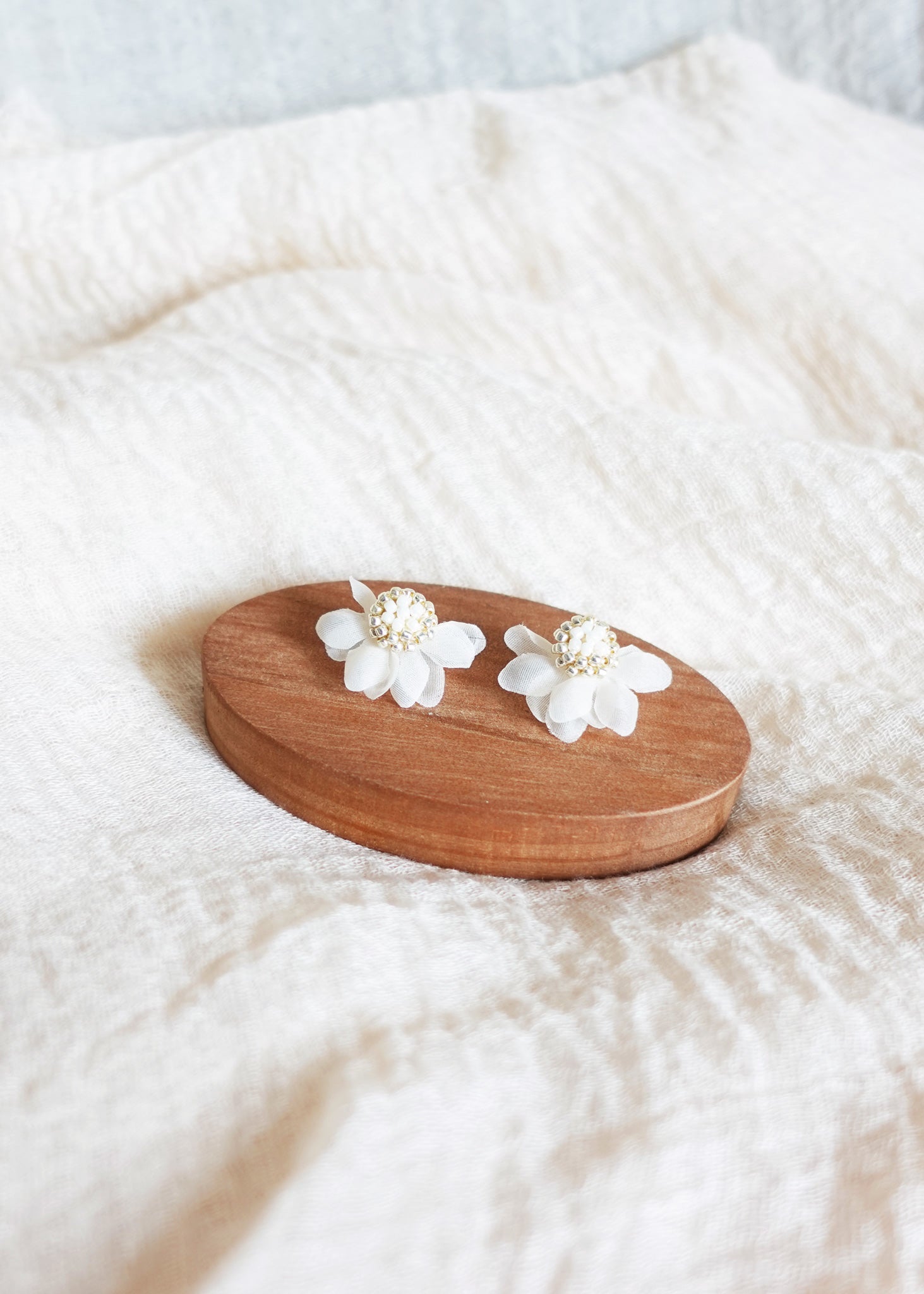 Ethereal Stud Earrings in White Display Top
