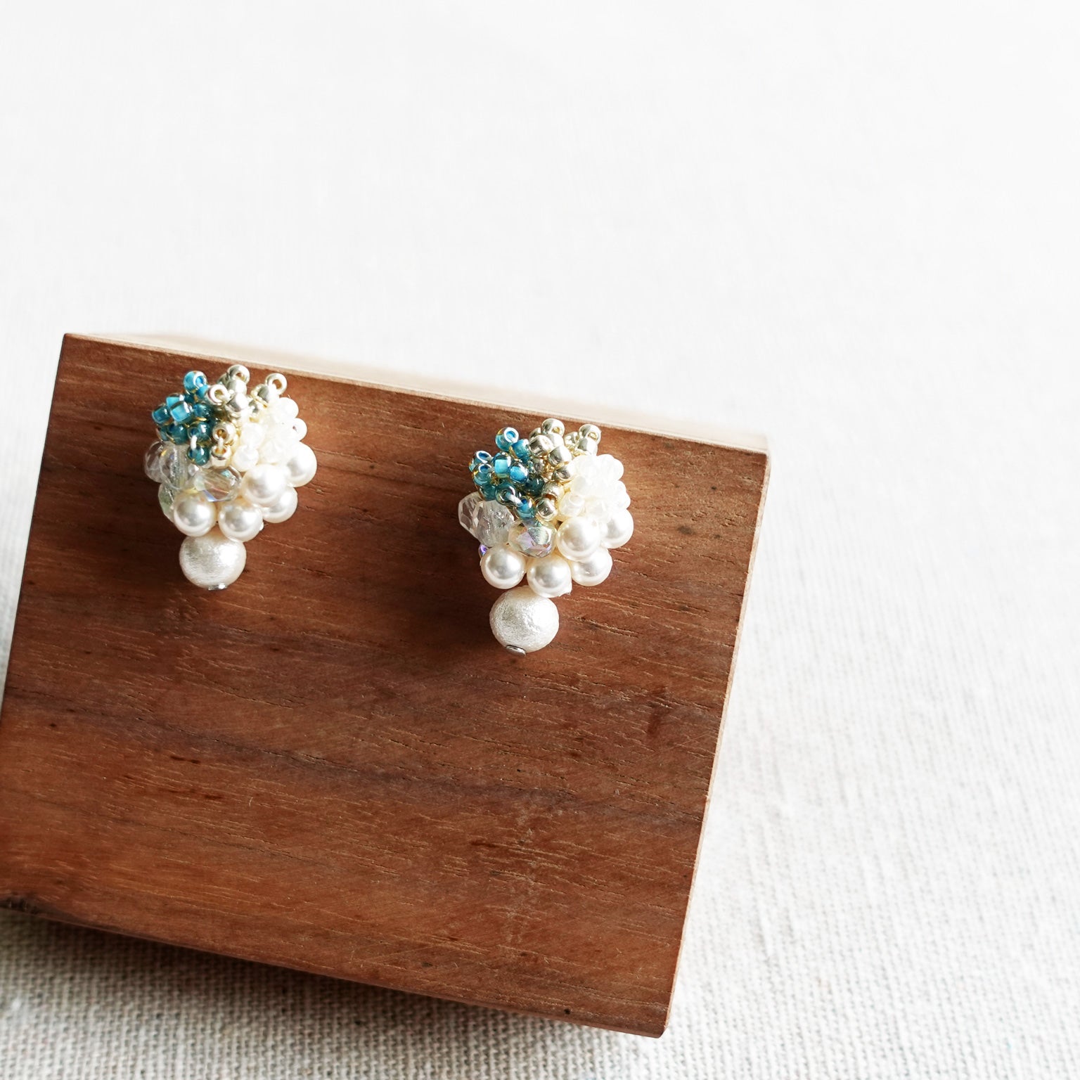 Fantasia Snowball Earrings in Ocean Green Display Right