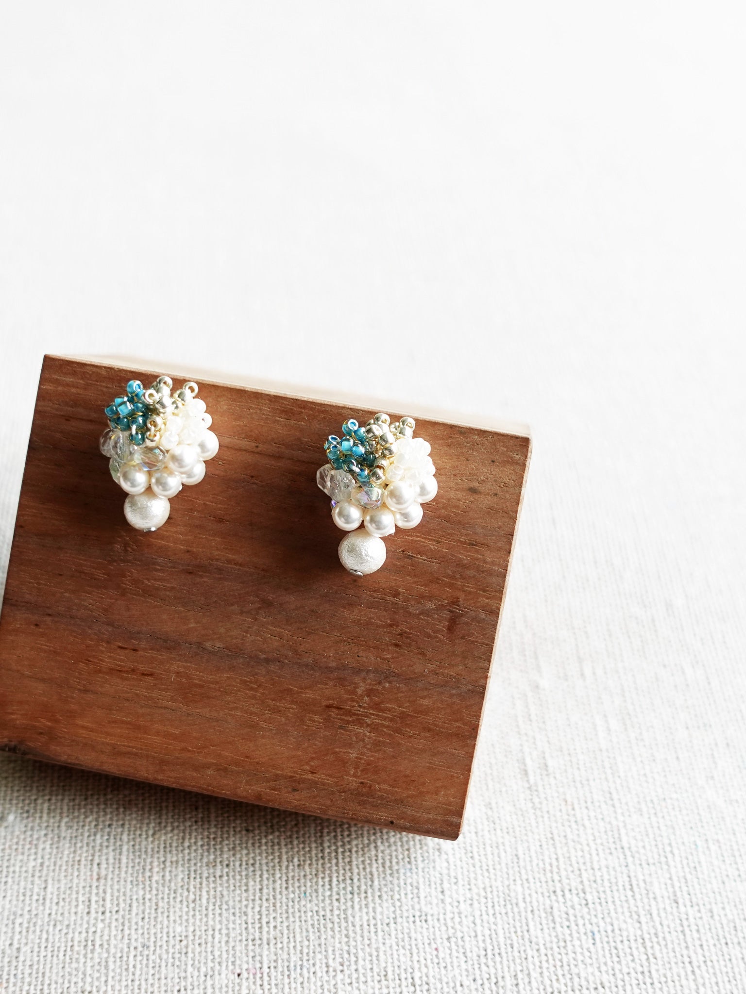 Fantasia Snowball Earrings in Ocean Green Display Right