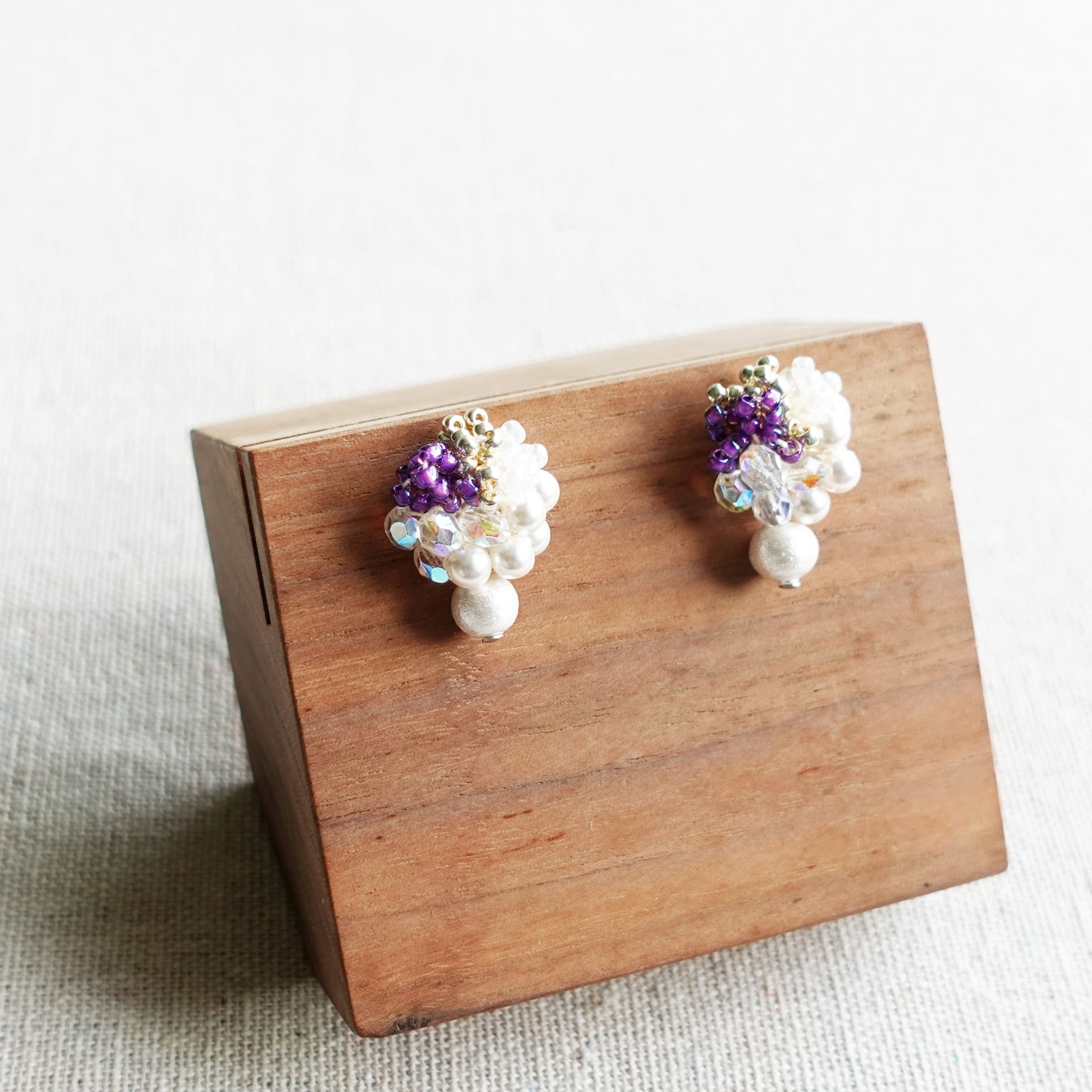 Fantasia Snowball Earrings in Royal Purple Display Left