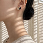 Fleur d'Or Stud Earrings in Black on Model