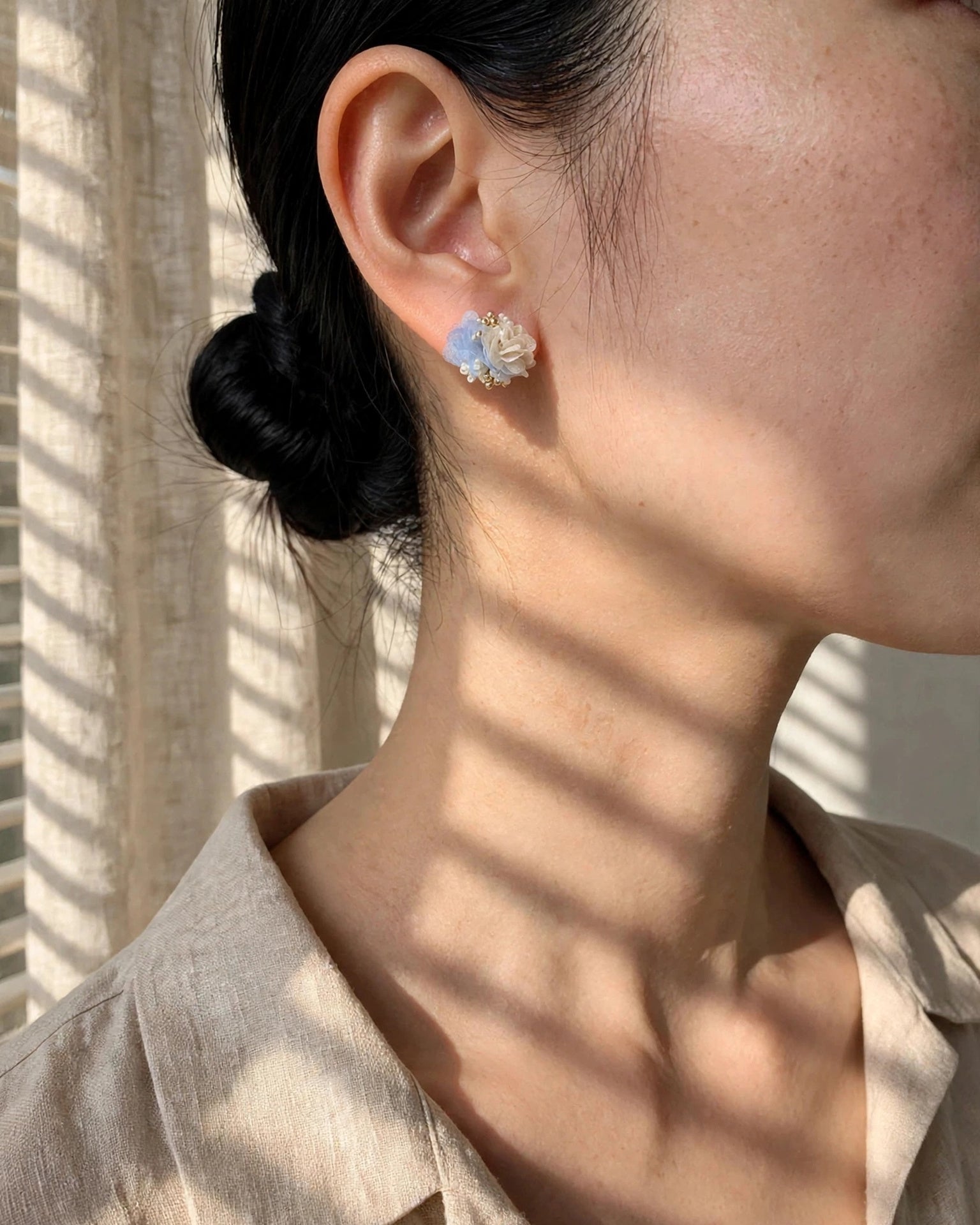 Fleur d'Or Stud Earrings in Blue on Model