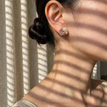 Fleur d'Or Stud Earrings in Brown on Model