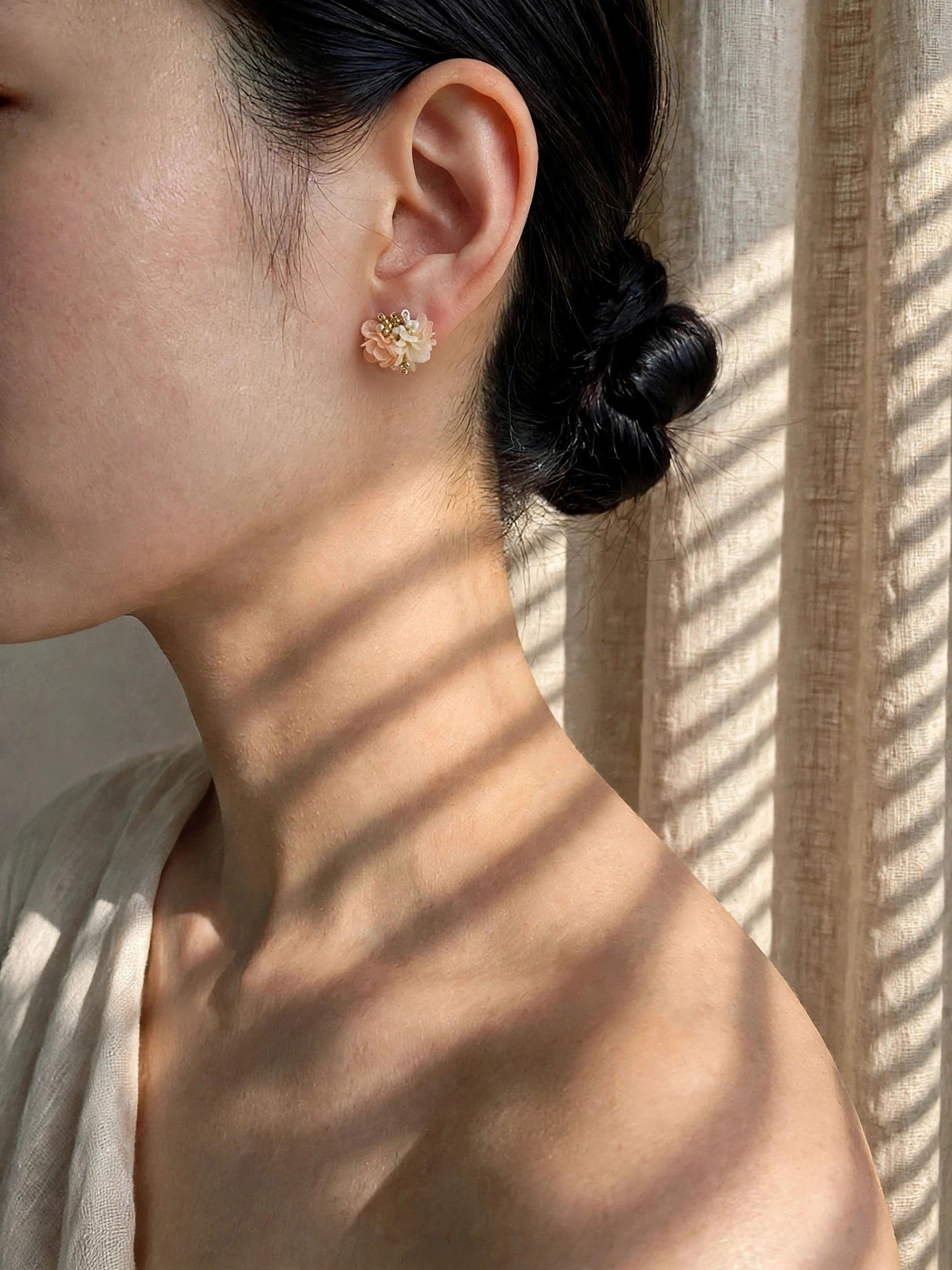 Fleur d'Or Stud Earrings in Coral on Model