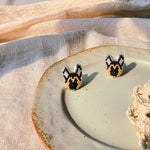 German shepherd stud earrings left