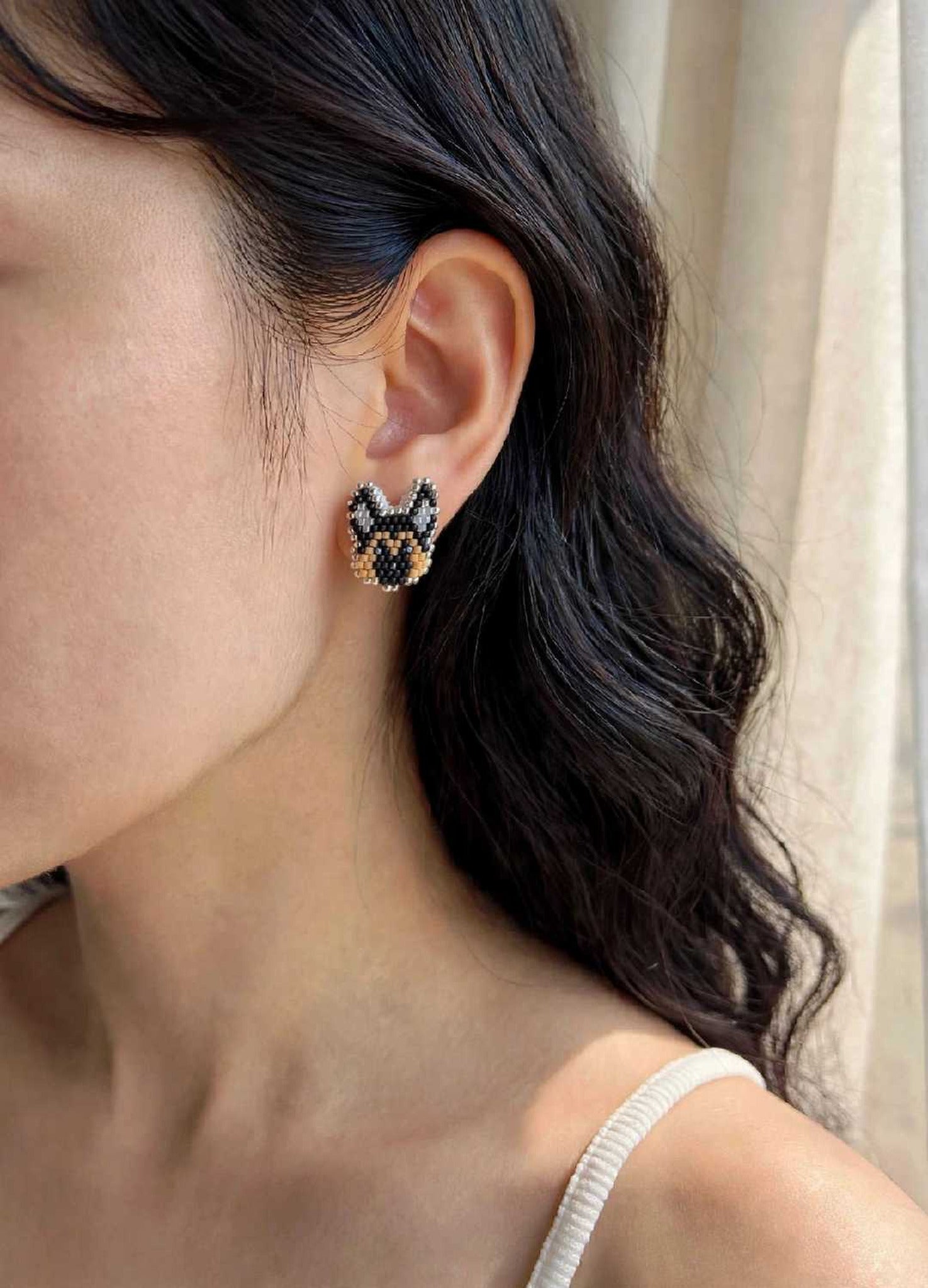 German shepherd stud earrings on model