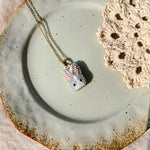 Grey bunny necklace left