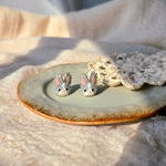 Grey bunny stud earrings front