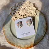 Grey bunny stud earrings on card