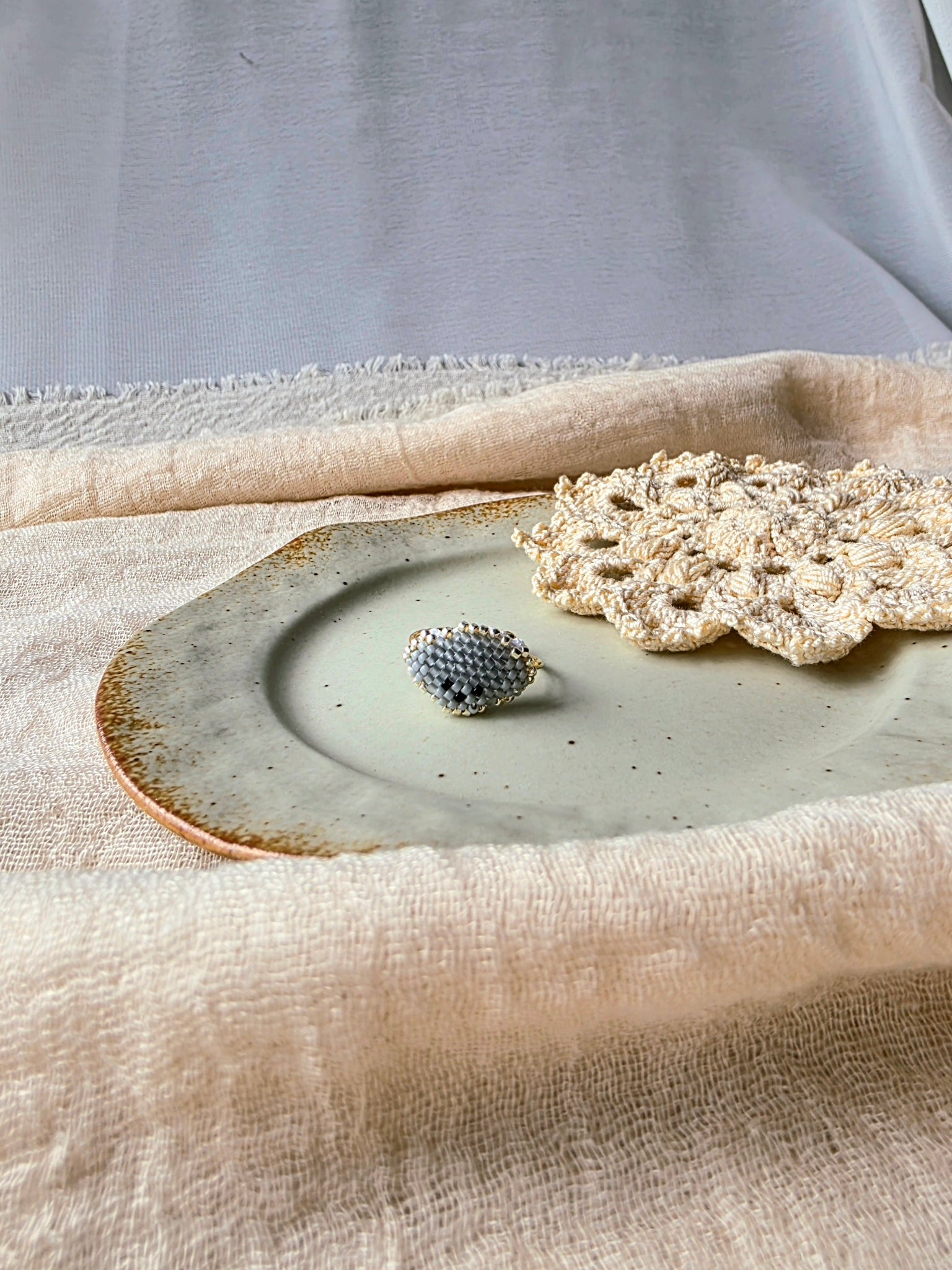 Grey poodle ring front