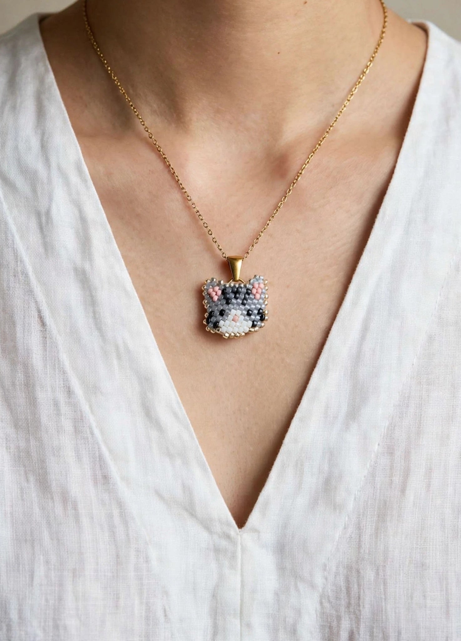 Grey tabby cat necklace on model