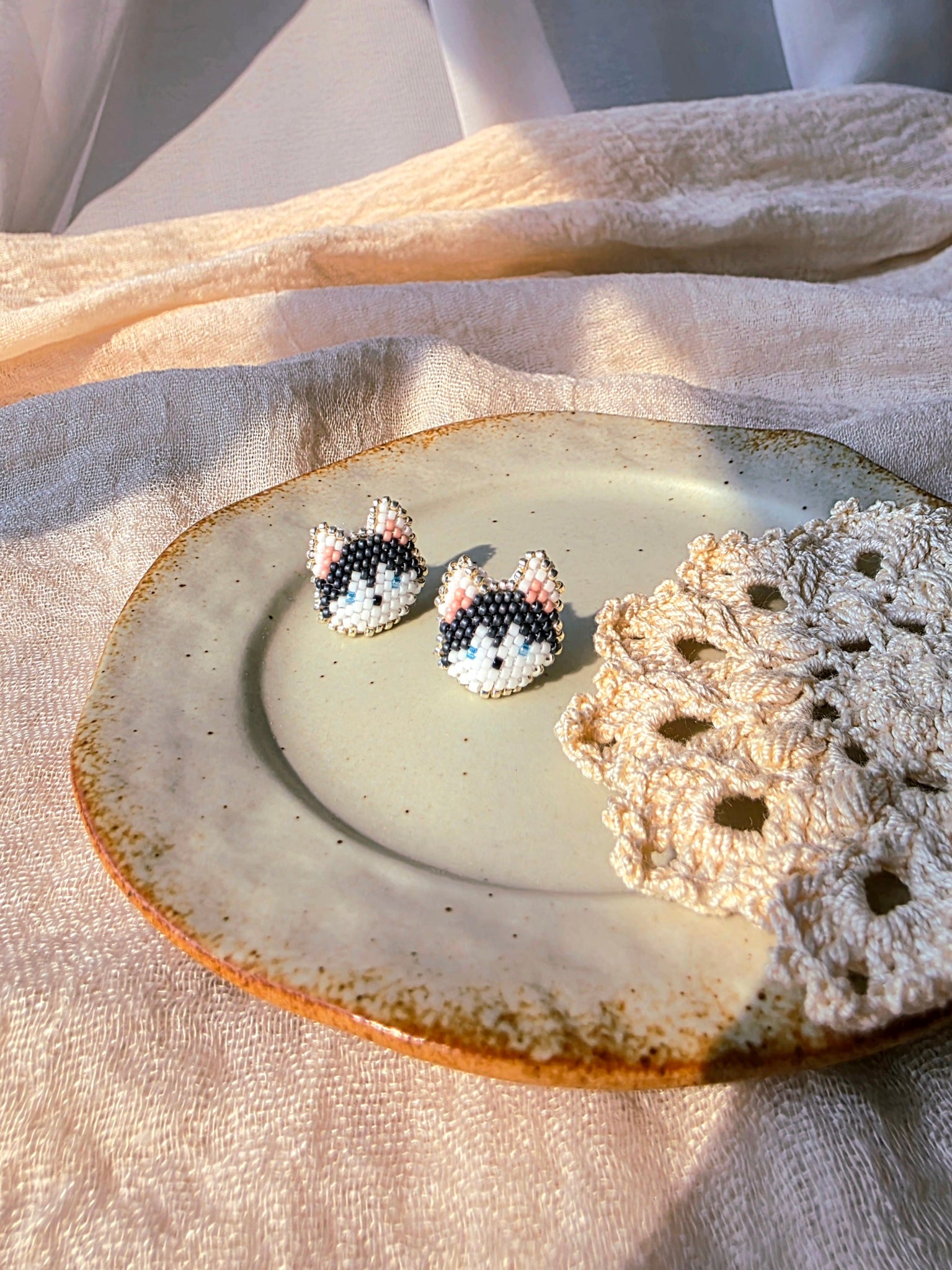 Husky stud earrings front