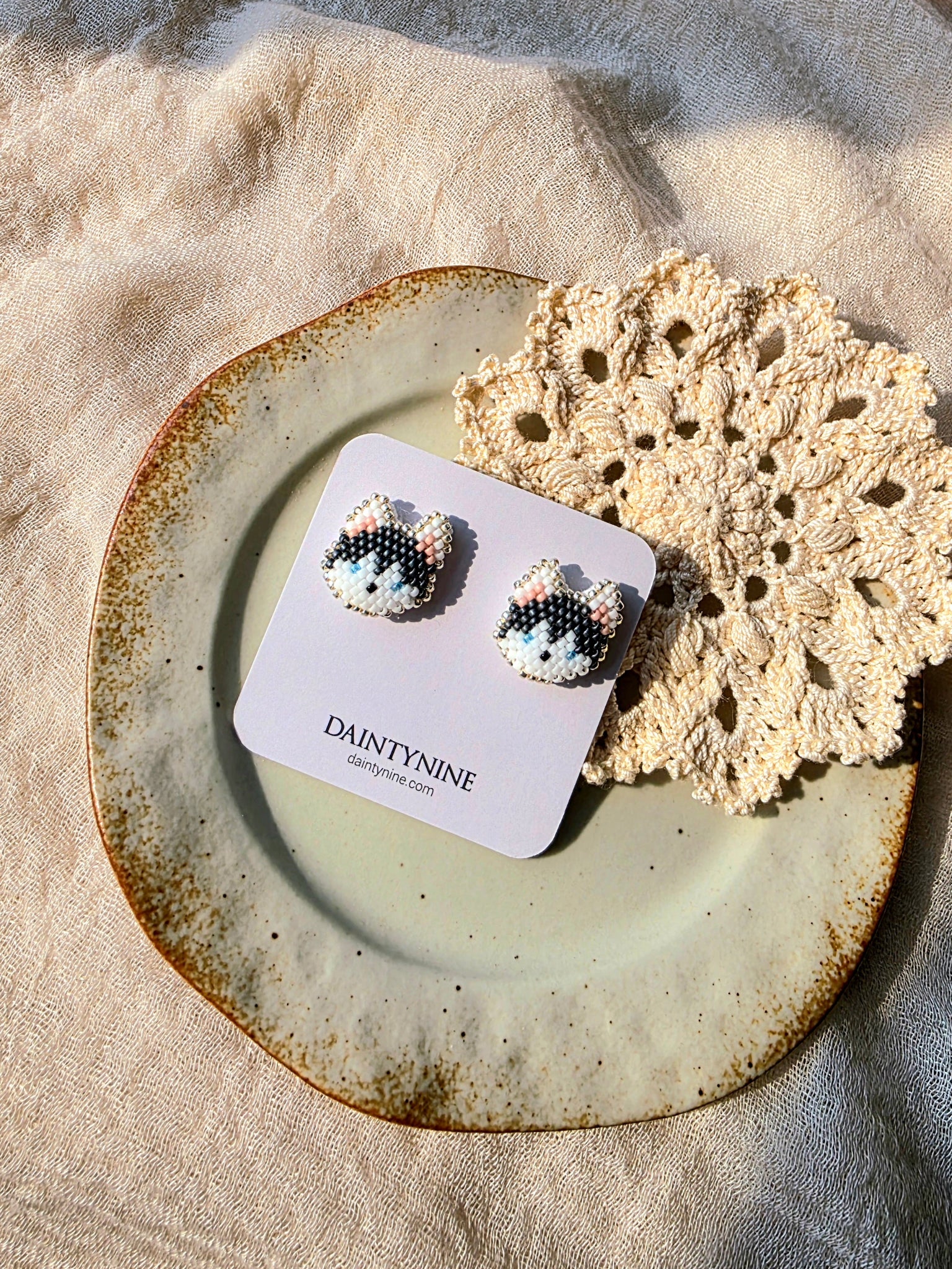 Husky stud earrings on card