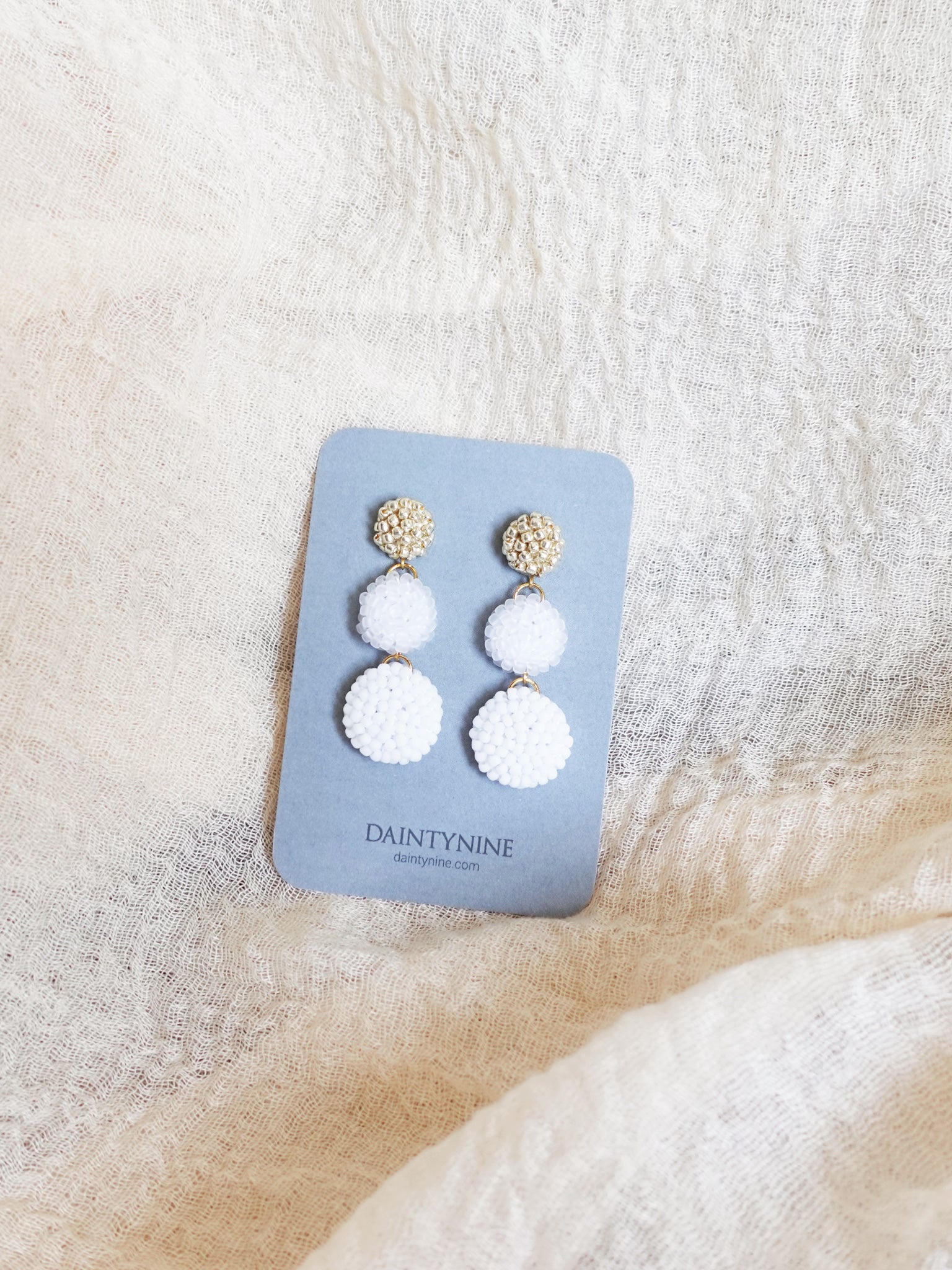 Juno Earrings in Cloud White Card Front