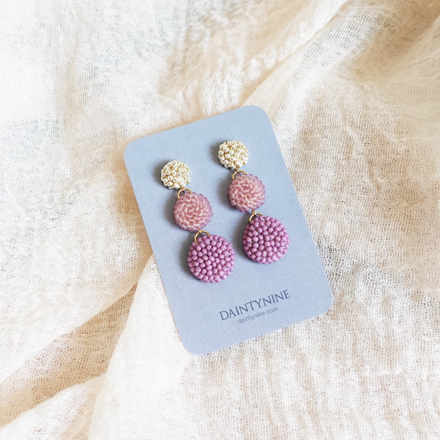 Juno Earrings in Mauve Purple Card