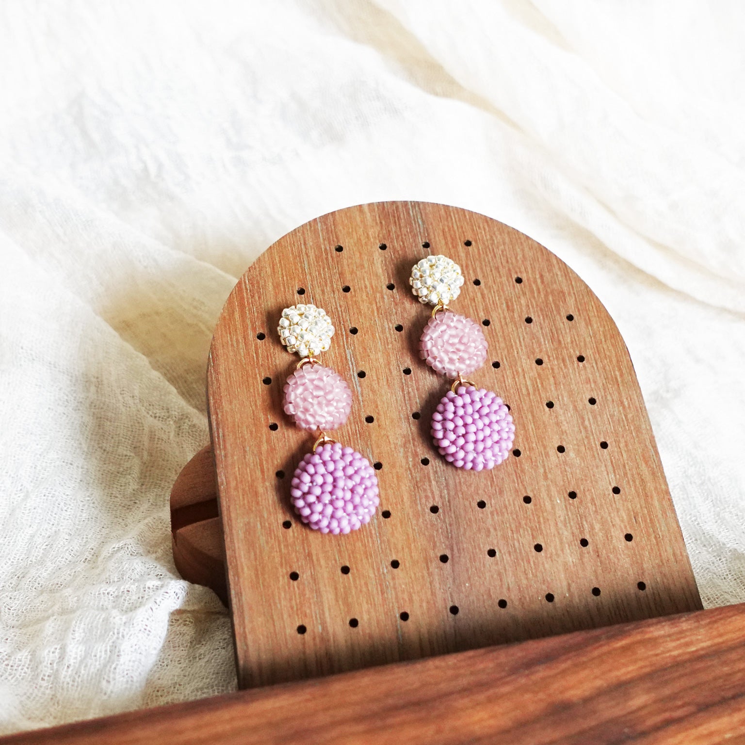 Juno Earrings in Mauve Purple Display Left