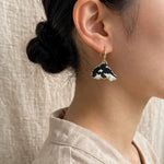 Killer whale drop earrings on model