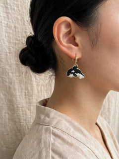 Killer whale drop earrings on model