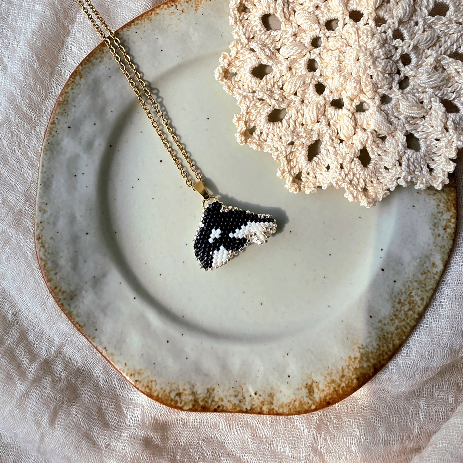 Killer whale orca necklace left