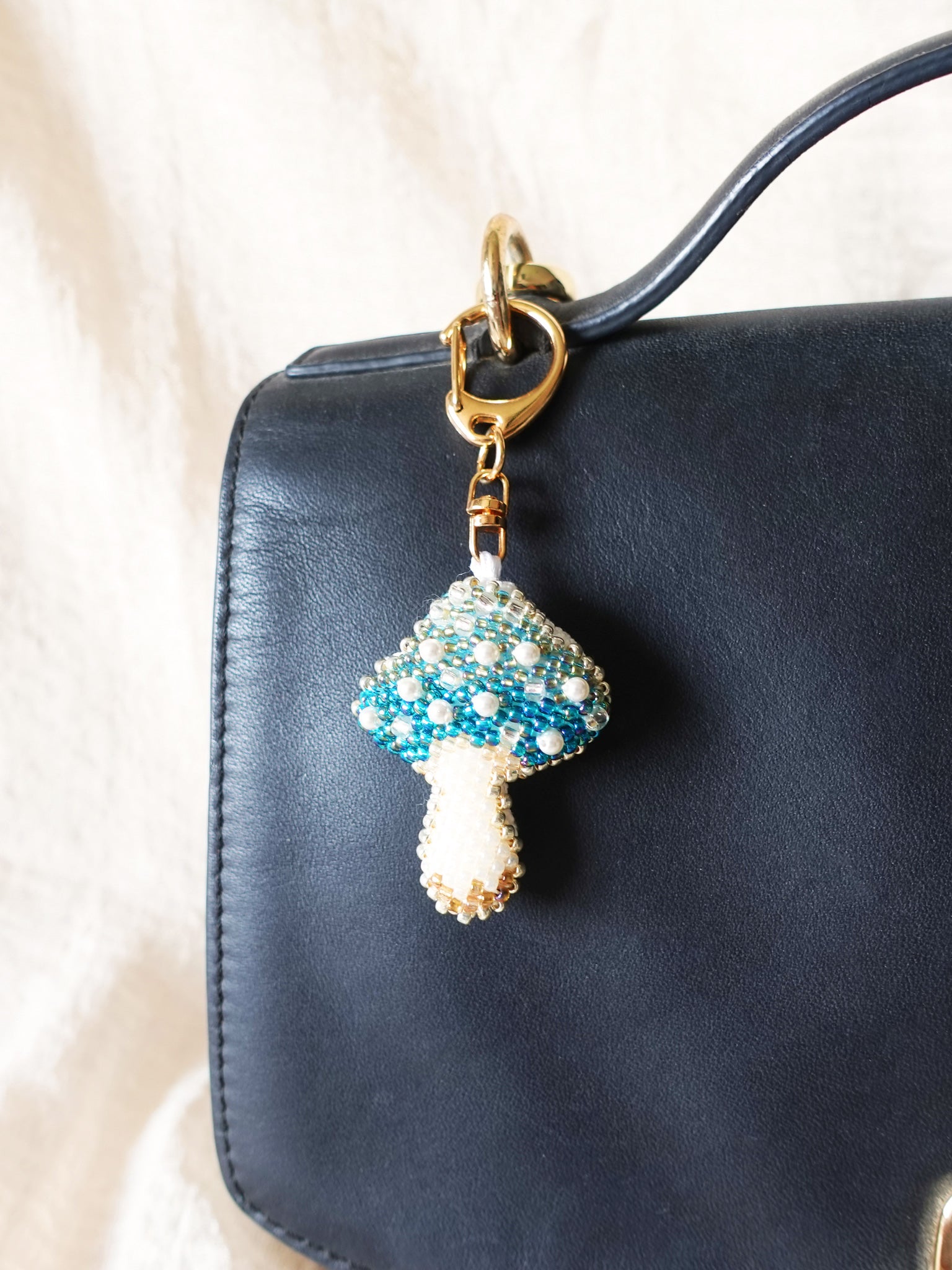 Magical Mushroom Charm in Blue Bag Close