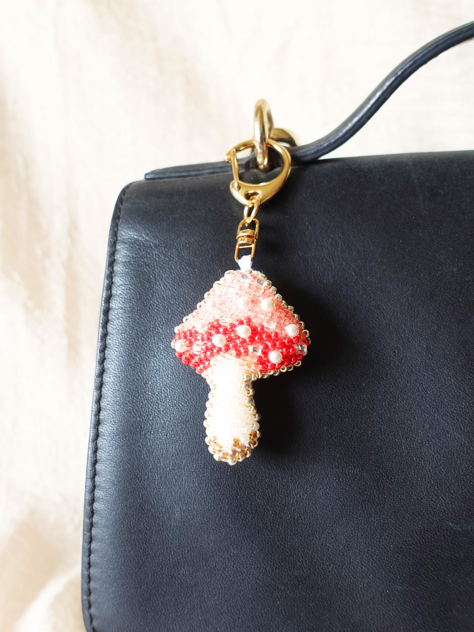 Magical Mushroom Charm in Red Bag Close