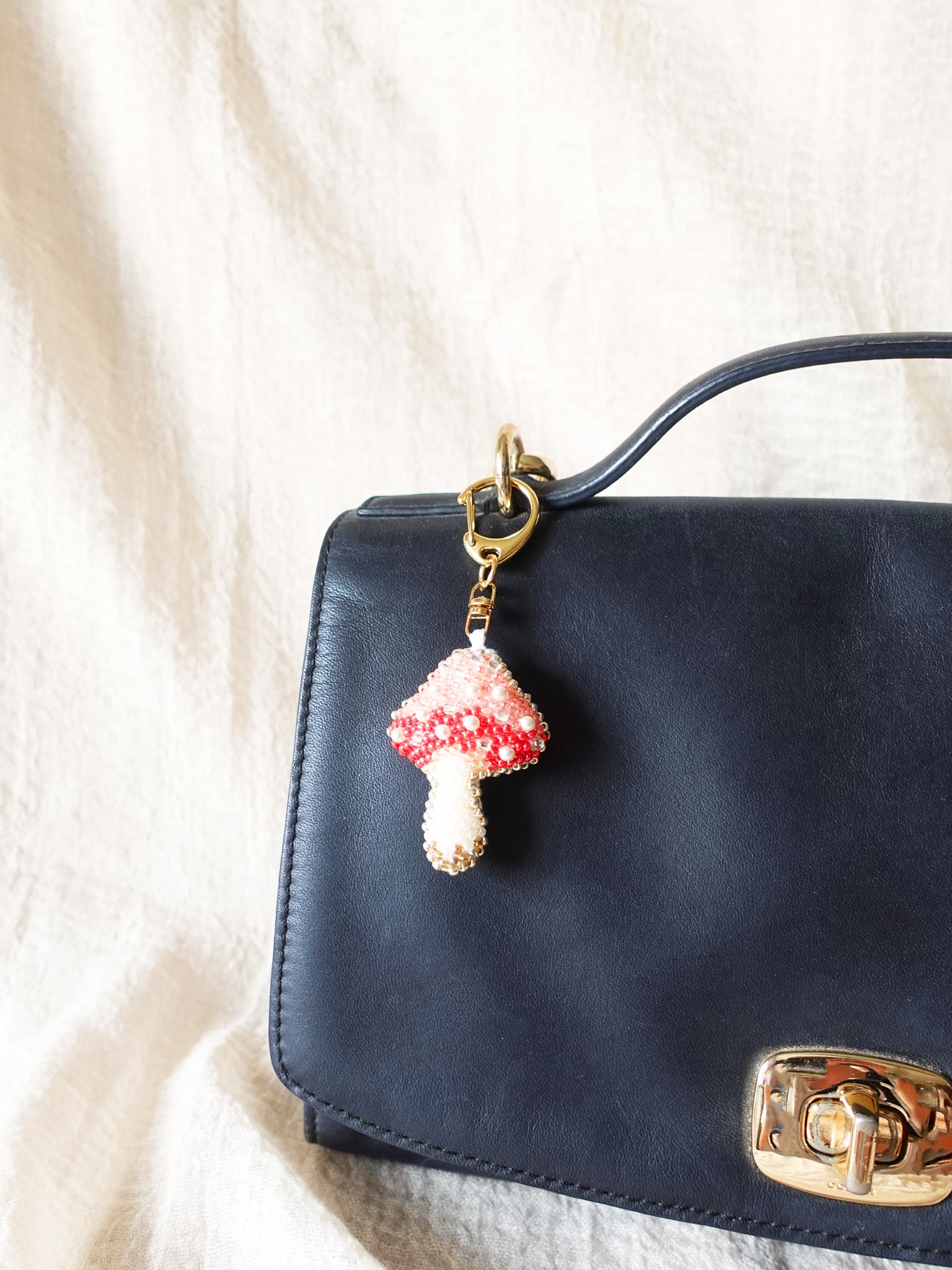 Magical Mushroom Charm in Red Bag Right