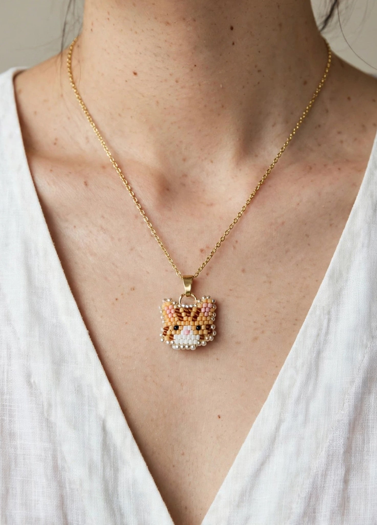 Orange tabby cat necklace on model