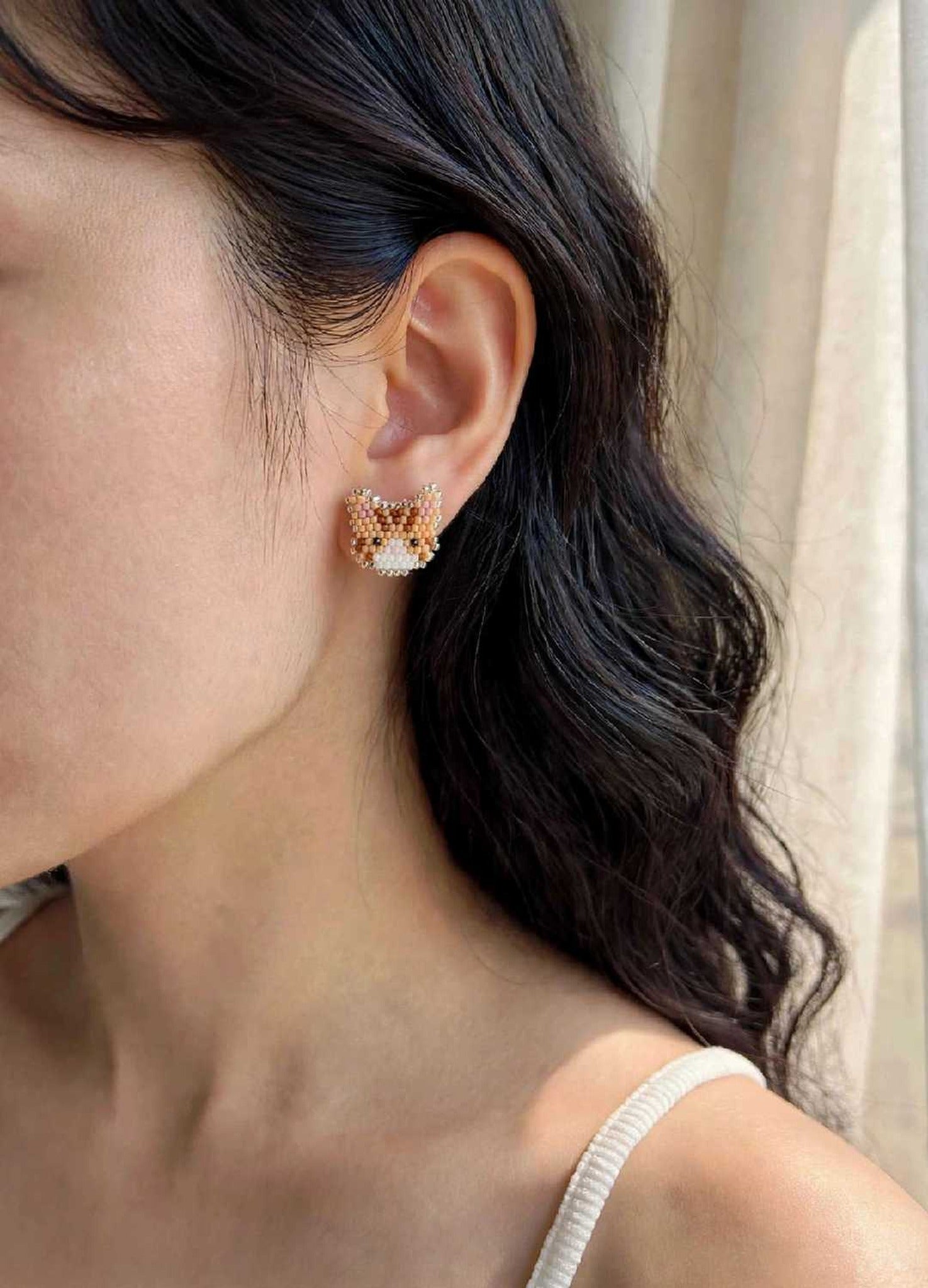 Orange tabby cat stud earrings on model