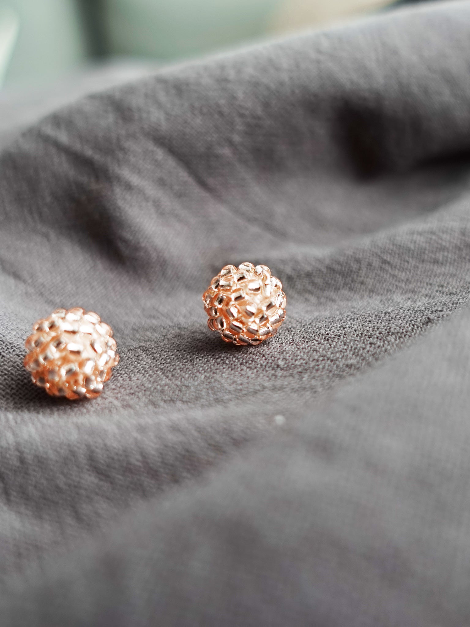 Orb Stud Earrings in Champagne Pink Front