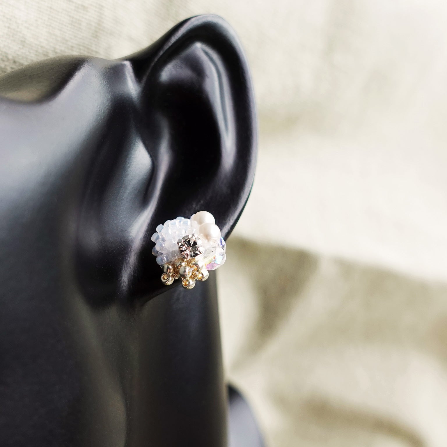 Polaris Stud Earrings in White Bust