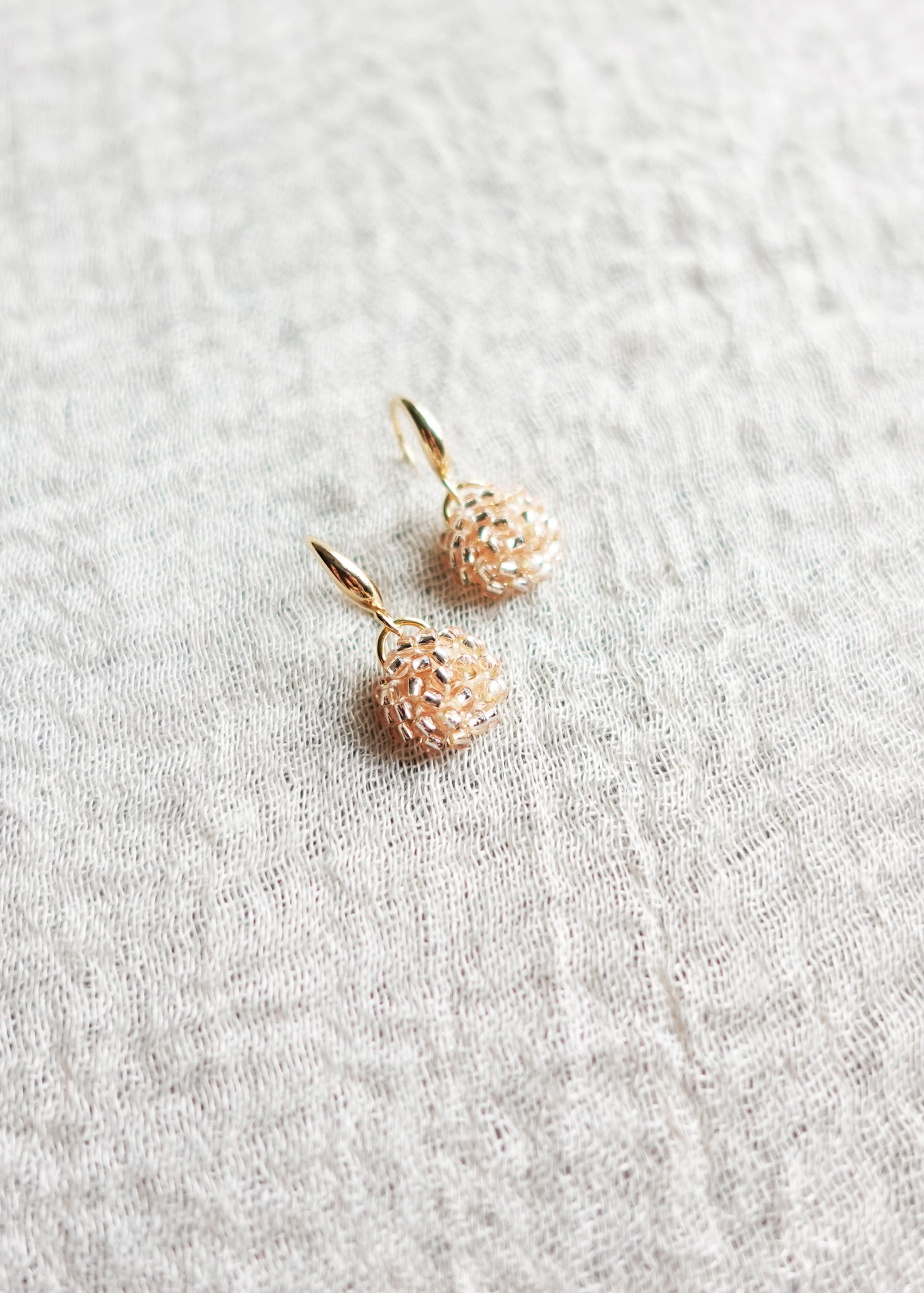 Prelude Drop Earrings in Champagne Pink Left Bottom