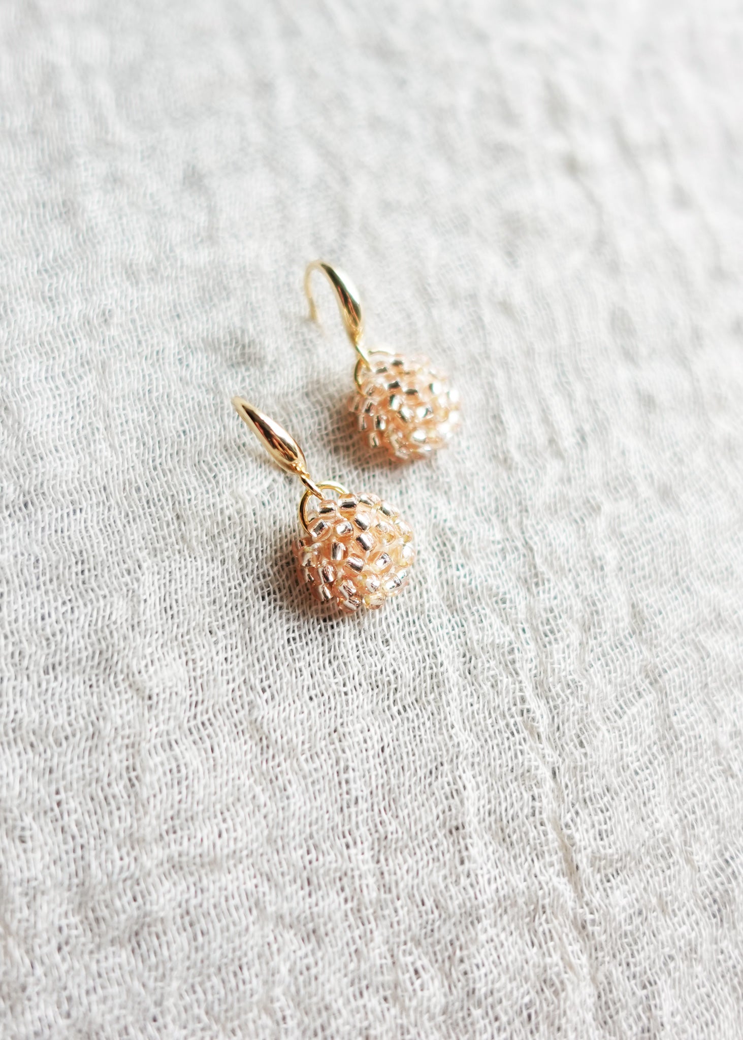 Prelude Drop Earrings in Champagne Pink Left Top