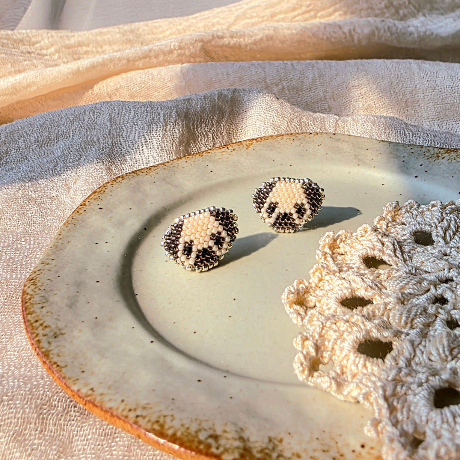 Pug stud earrings front