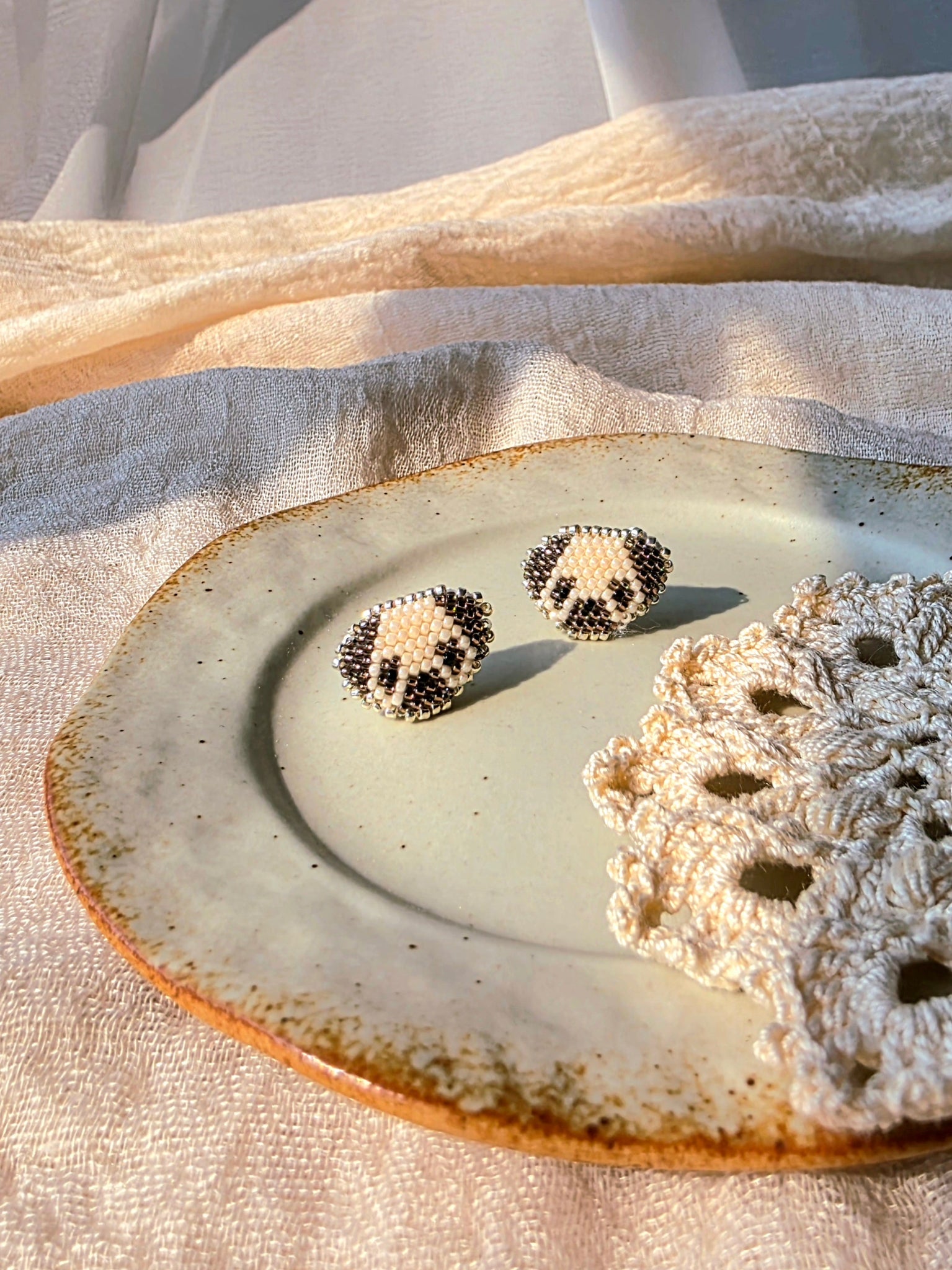 Pug stud earrings front