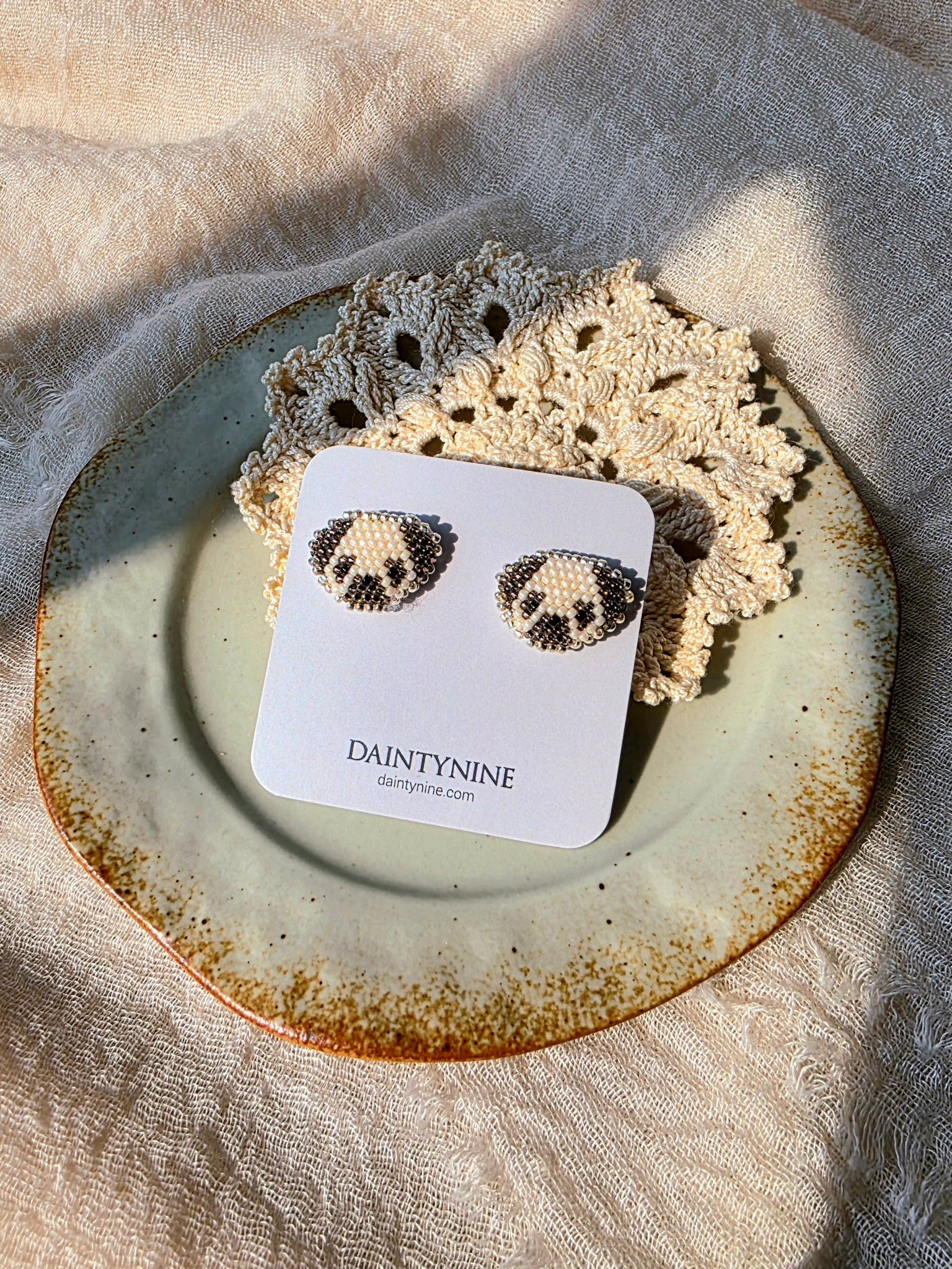 Pug stud earrings on card