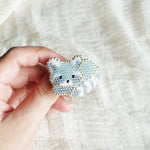 Raccoon Loaf Brooch Pin Held
