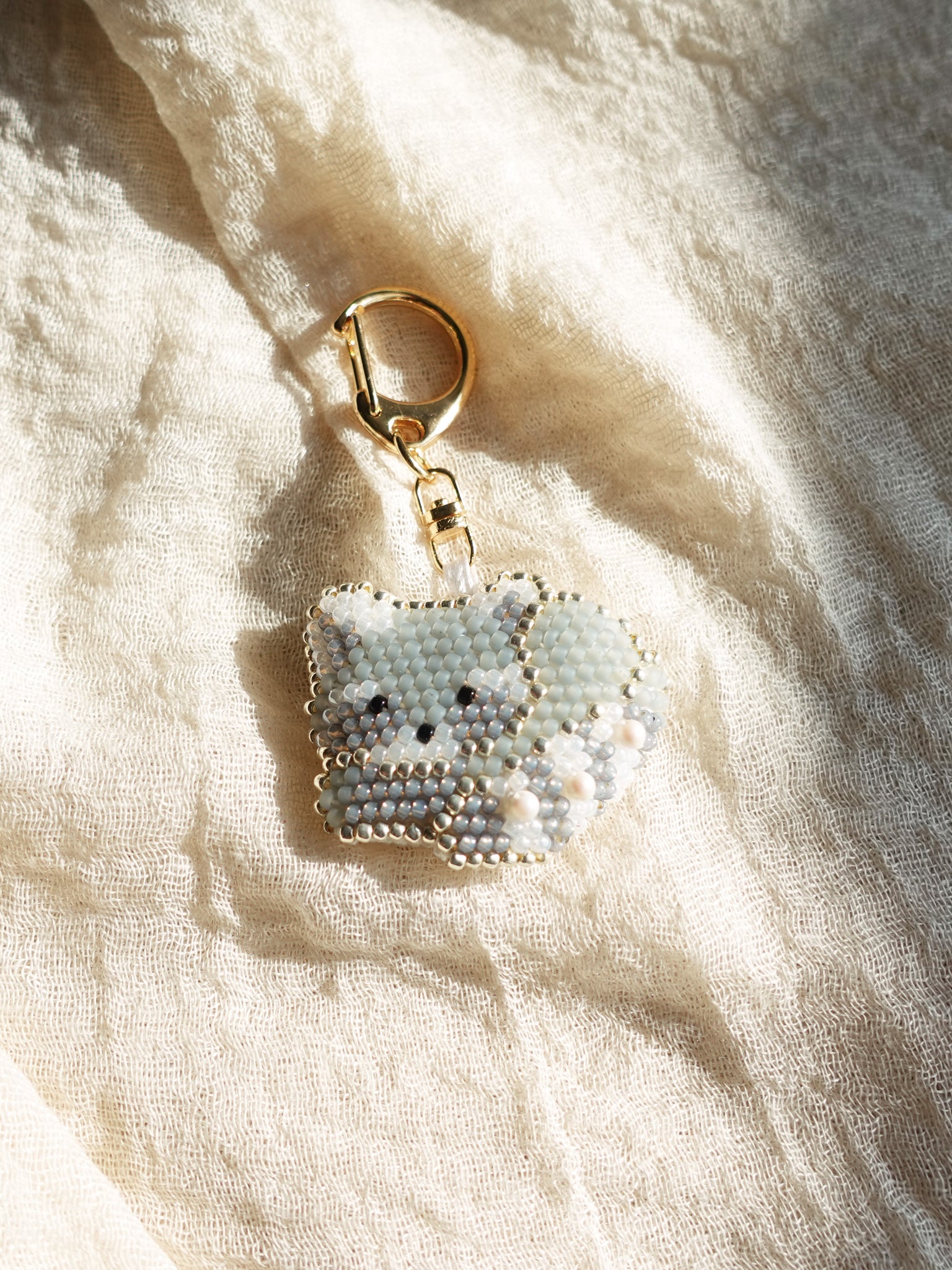 Raccoon Loaf Charm Front