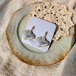 Shark drop earrings on card