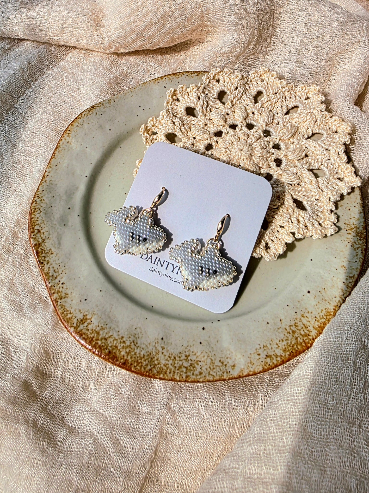 Shark drop earrings on card