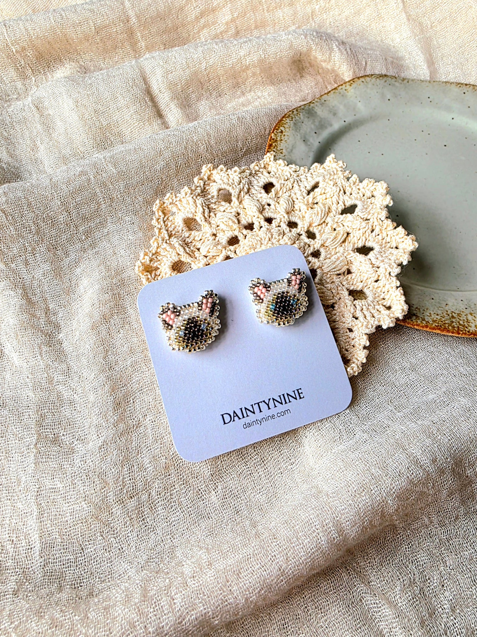 Siamese cat stud earrings on card