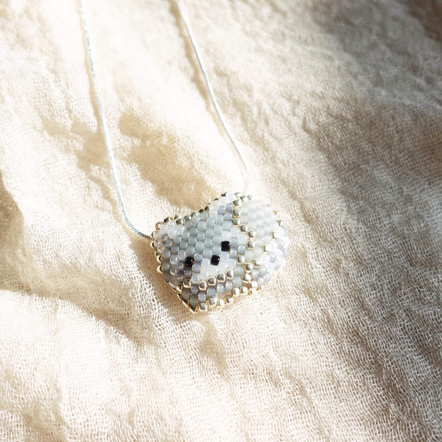Small Raccoon Loaf Necklace Left
