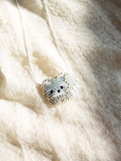 Small Raccoon Loaf Necklace Left