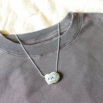 Small Raccoon Loaf Necklace Shirt Left