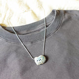 Small Raccoon Loaf Necklace Shirt Left