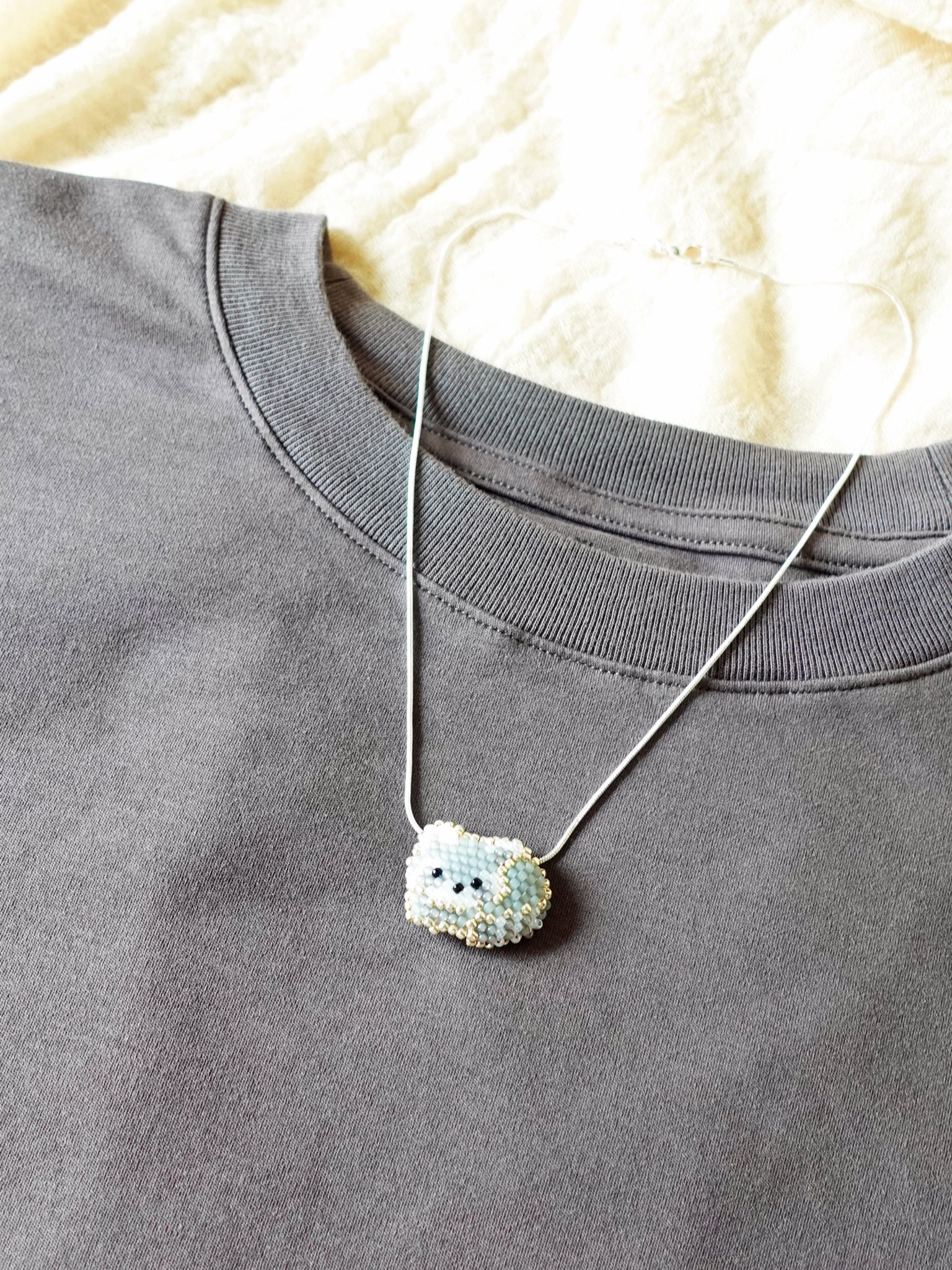 Small Raccoon Loaf Necklace Shirt Right
