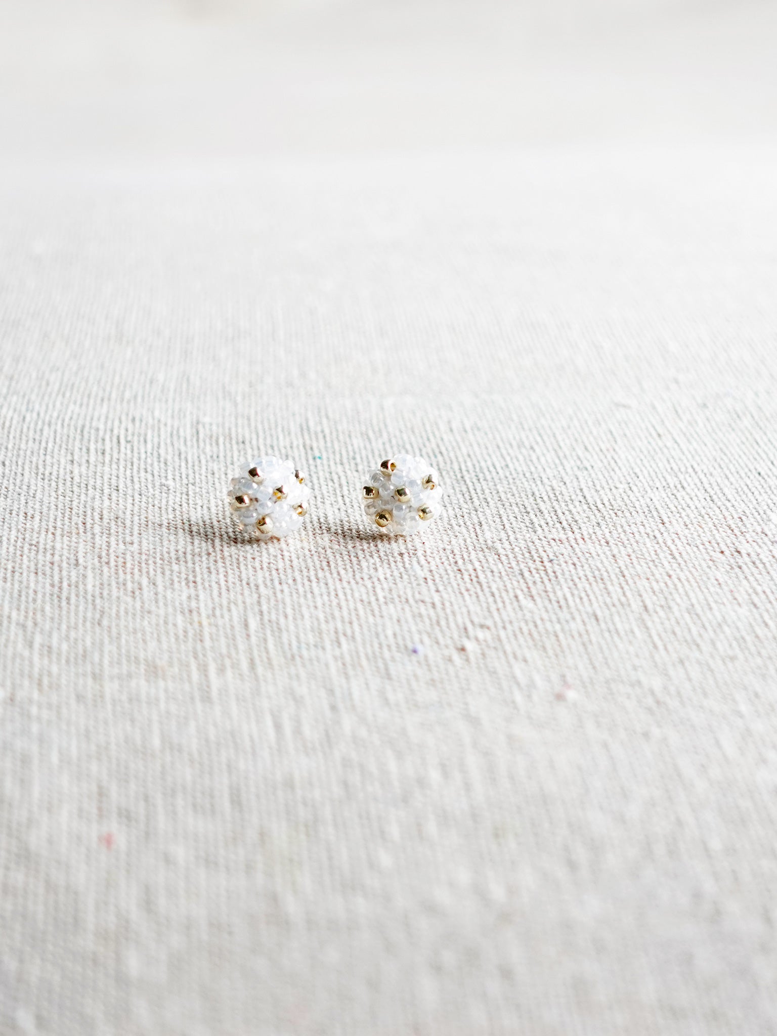 Star Dust Petite Stud Earrings in White Front